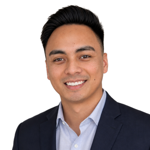 Professional headshot of a smiling man in a suit.